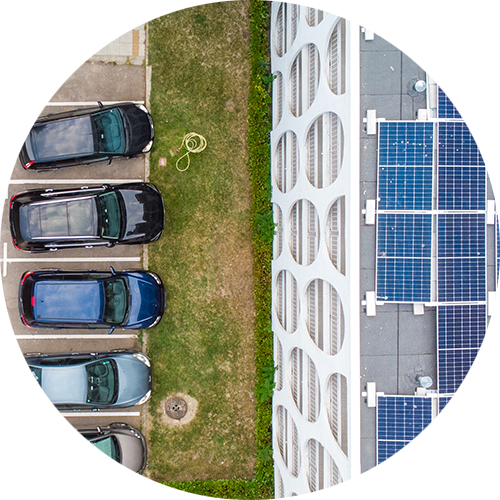 a group of cars parked next to each other in a parking lot.