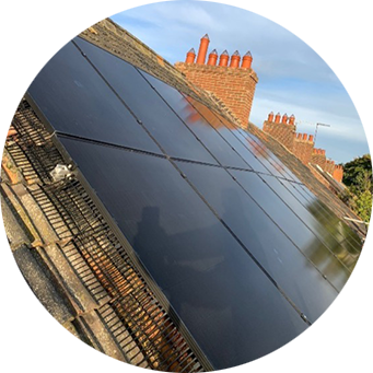 A solar panel on the roof of a house.